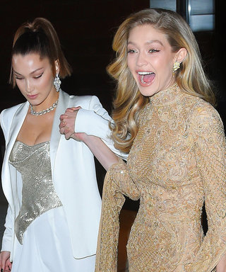 Gigi Hadid Nearly Takes a Tumble in Gold Lace Gown, Bella Catches Her Fall