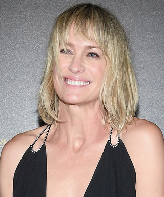 Robin Wright Wears the Sexiest Plunging LBD at Paris Fashion Week