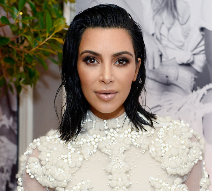 Kim Kardashian Poses Naked While Climbing a Tree—Yes, Really